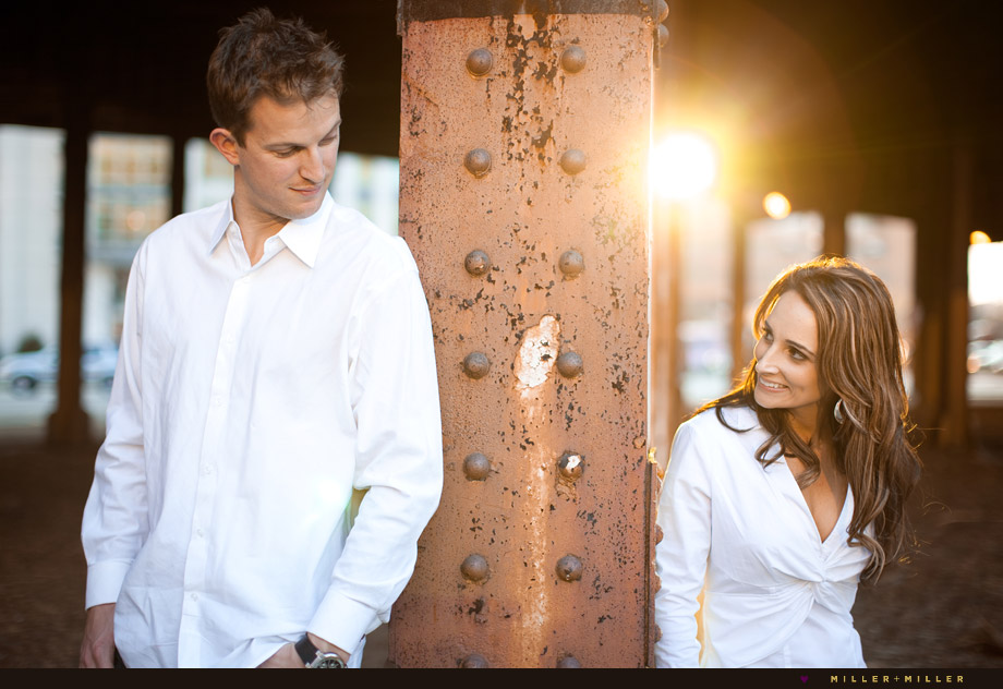 couple portraits by harbor at sunset