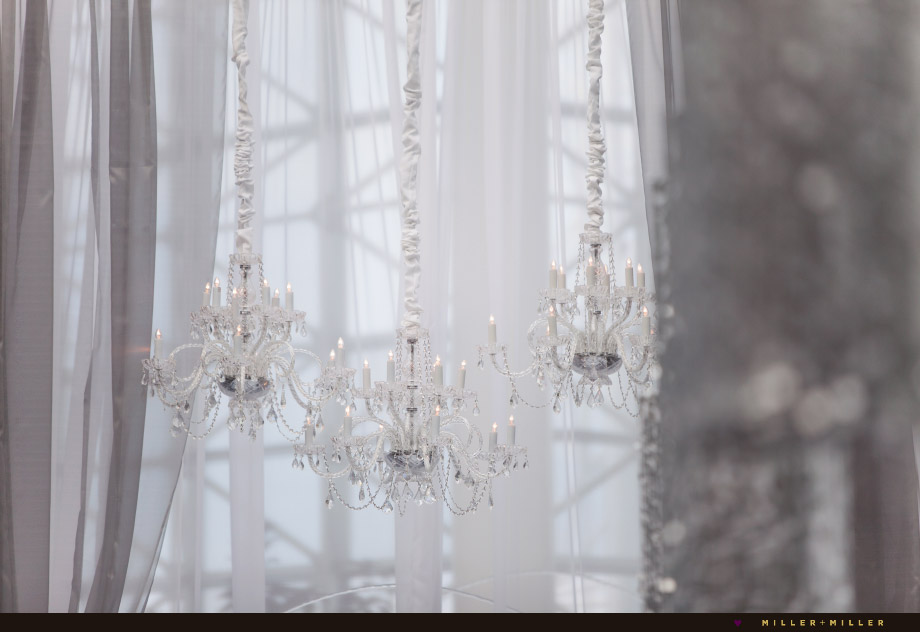 hanging crystal chandeliers above altar