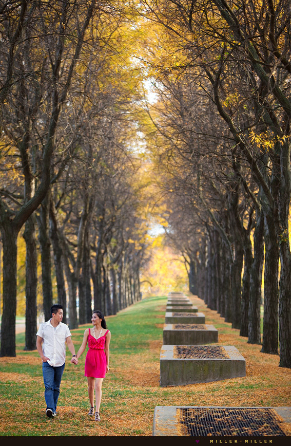 couple walking fall leaves forest trees