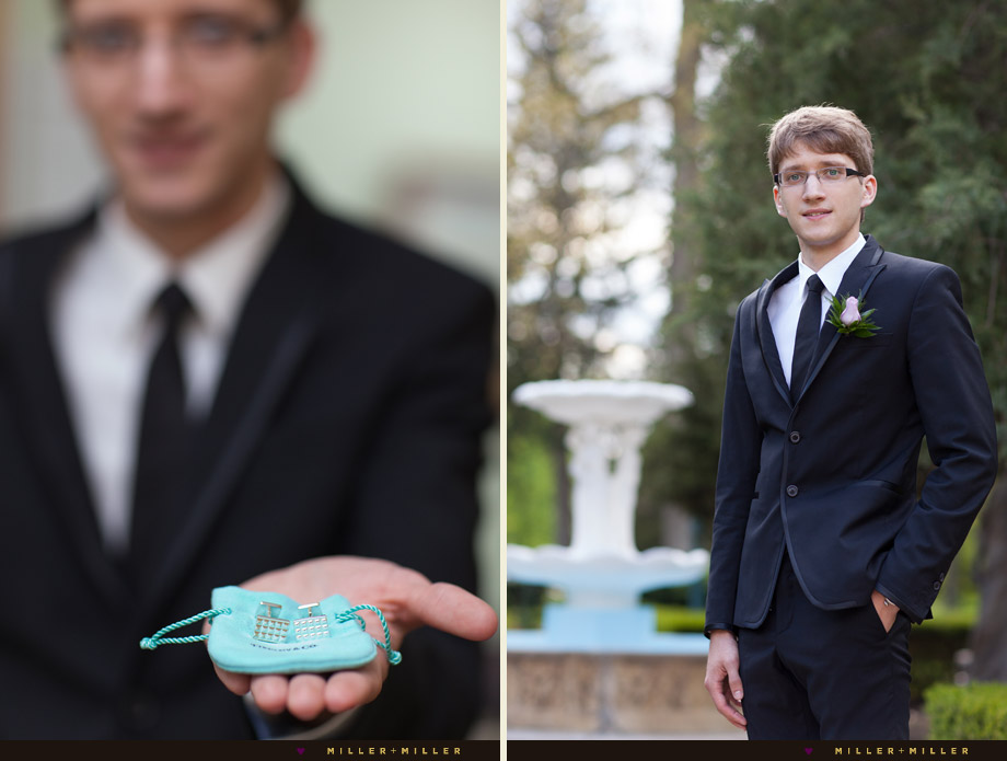 groom portrait holding cufflinks