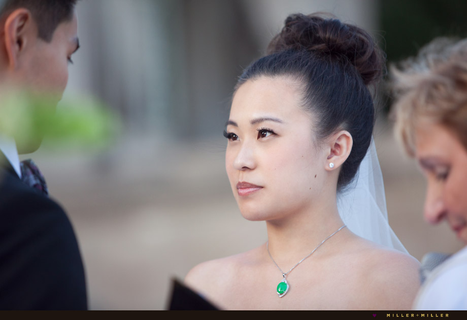 photographer photographs bride reciting vows